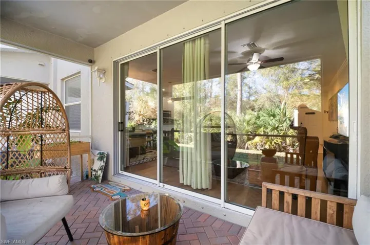Sunroom featuring brick floors