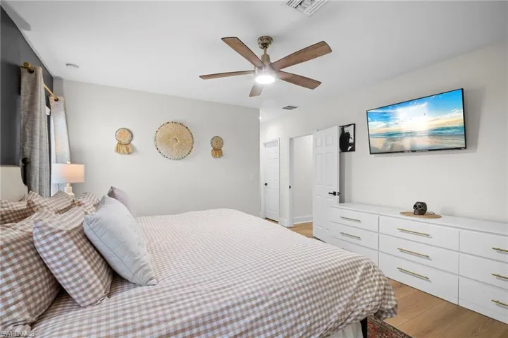 Bedroom with light wood-type flooring and ceiling fan