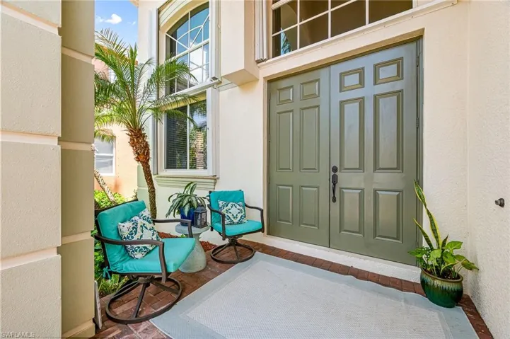 Covered front porch with large double doors