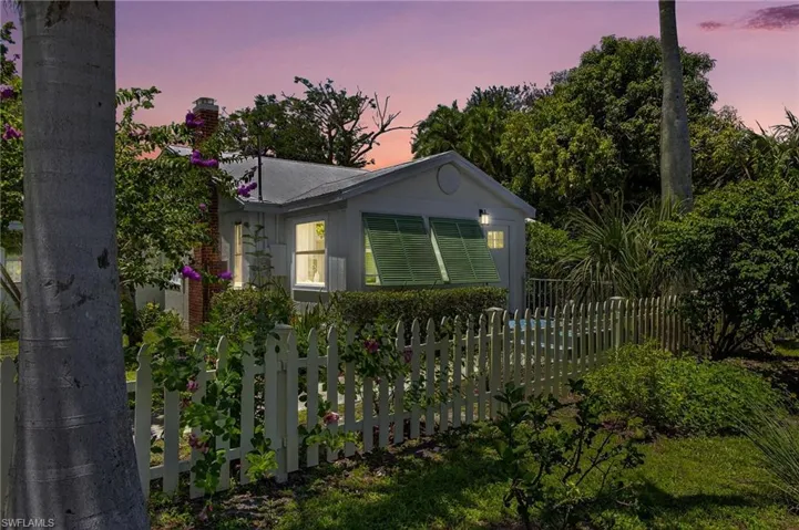 Property exterior at dusk with a chimney