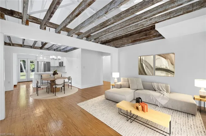 Virtual Stage Living room with wood finished floors, and beam ceiling