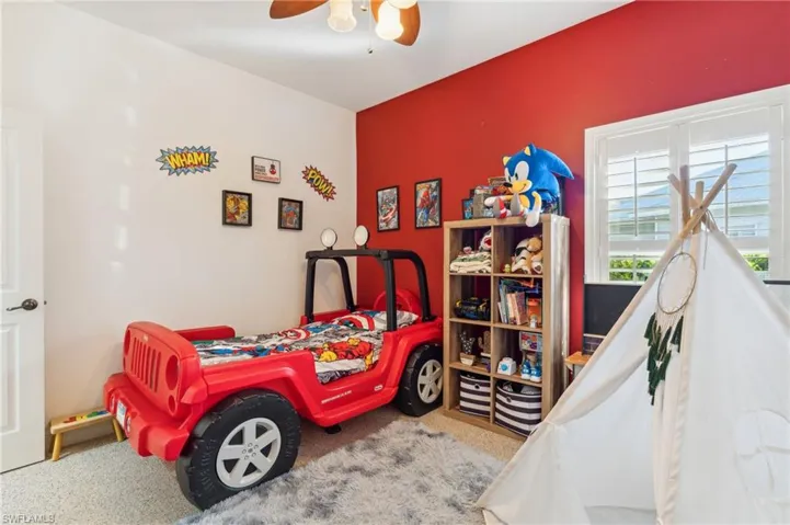 Bedroom featuring carpet flooring and ceiling fan