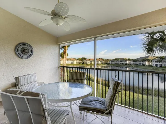Sunroom with a water view