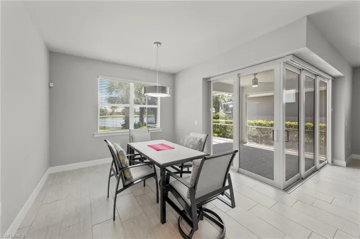 Eat-in Dining area where you overlook the lanai that has disappearing sliders and included in the Great room and kitchen.