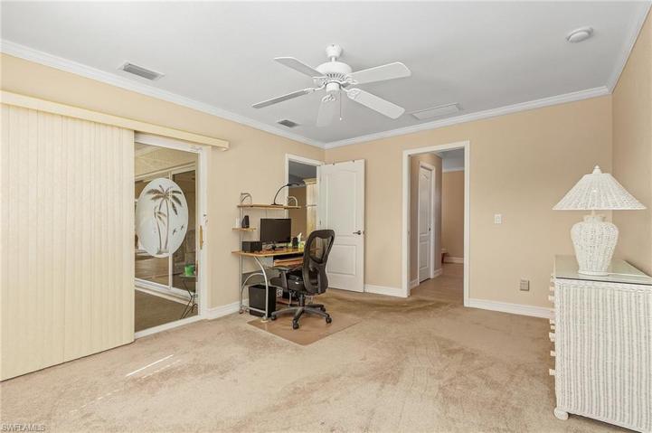 Master bedroom #1 with sliding glass doors out to the lanai and walk in closets.