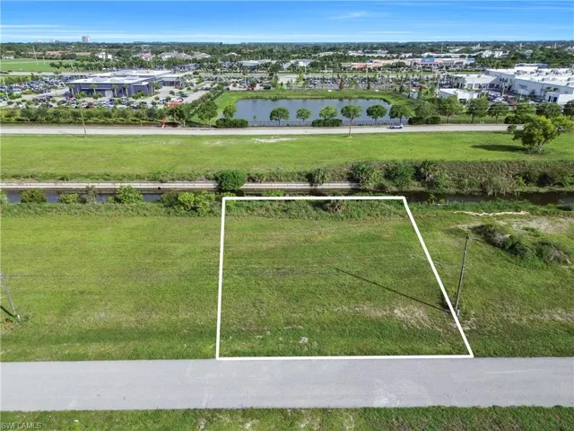 Expansive green lot with established perimeter boundaries