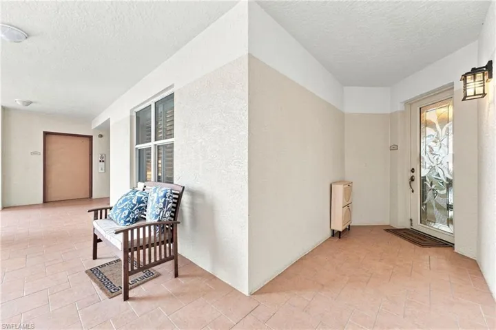 A beautiful etched-glass entry door welcomes you home, just steps from the elevator. Relax on the inviting front balcony while taking in stunning skyline views of Downtown Fort Myers.