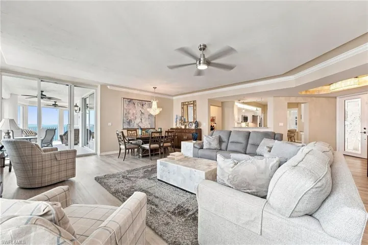 The kitchen features a convenient pass-through window, creating an effortless connection to the living area and making entertaining and serving guests a breeze.