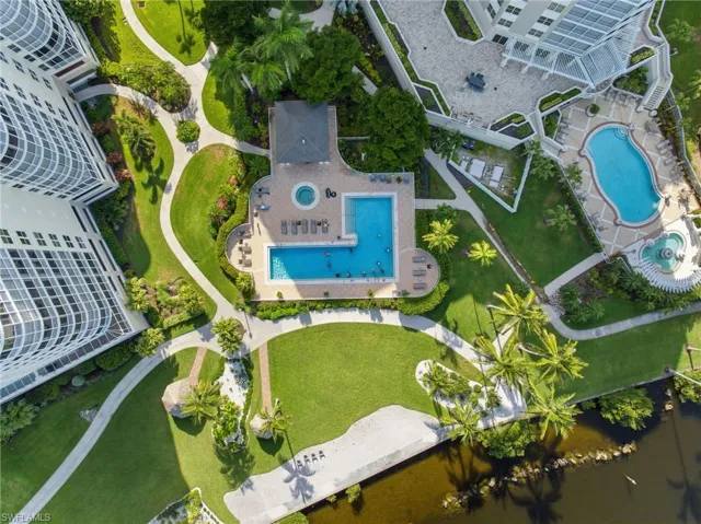 Resort-style community amenities include a sparkling pool and hot tub, plus a private beach area perfect for grilling, playing volleyball, or simply relaxing and soaking up the Florida sunshine.