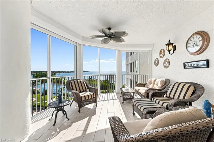 The oversized lanai is beautifully finished with elegant subway tile flooring, creating a stylish and inviting outdoor living space that perfectly complements the spectacular waterfront views.