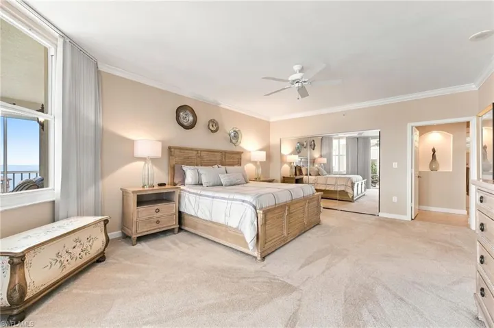The spacious primary suite features an expansive custom-designed closet with abundant hanging space, generous shelving, and ample storage to keep your wardrobe beautifully organized.