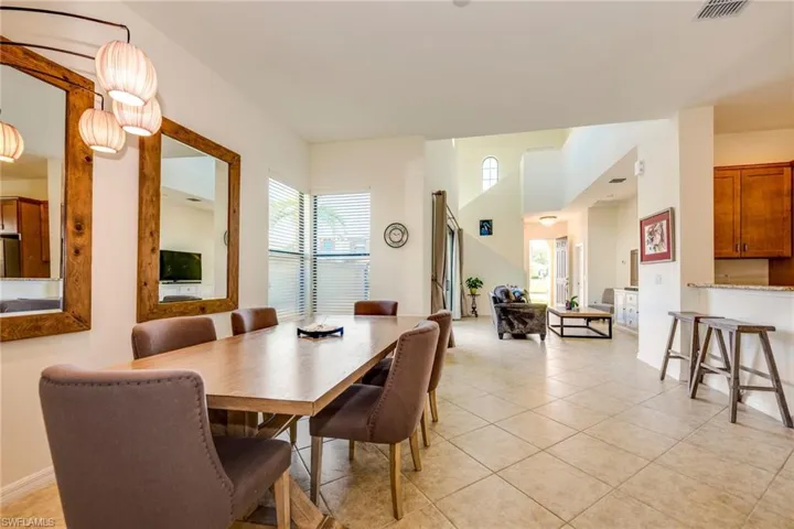 Dining area featuring healthy amount of natural light and light tile patterned floors