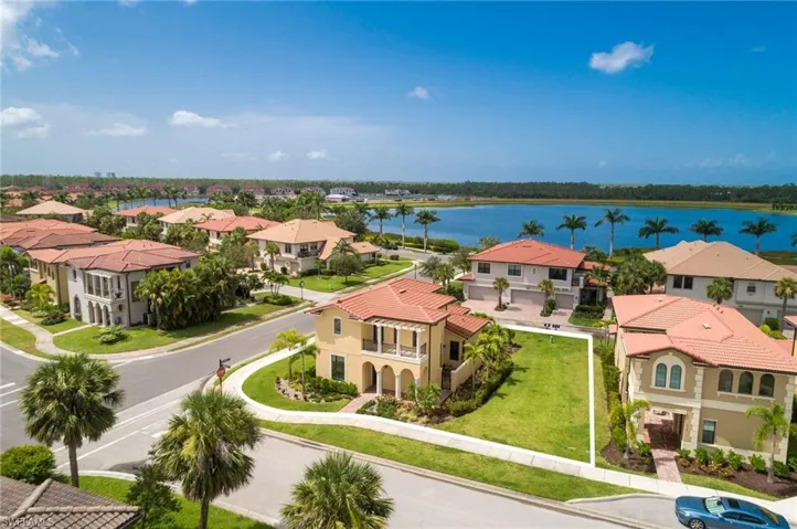Aerial perspective of suburban area featuring a large body of water