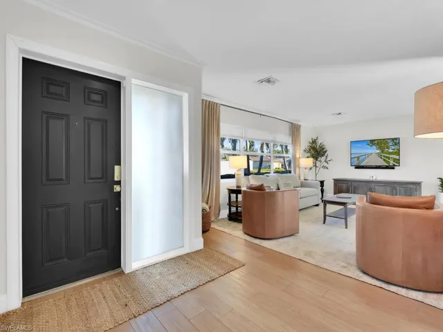Foyer entrance featuring light hardwood / wood-style floors