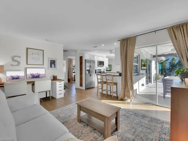 Living room with light hardwood / wood-style floors