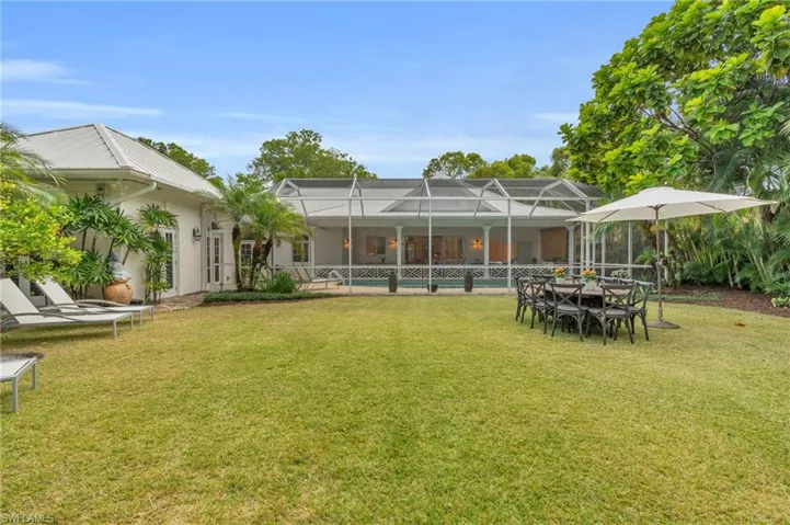 View of yard featuring a lanai