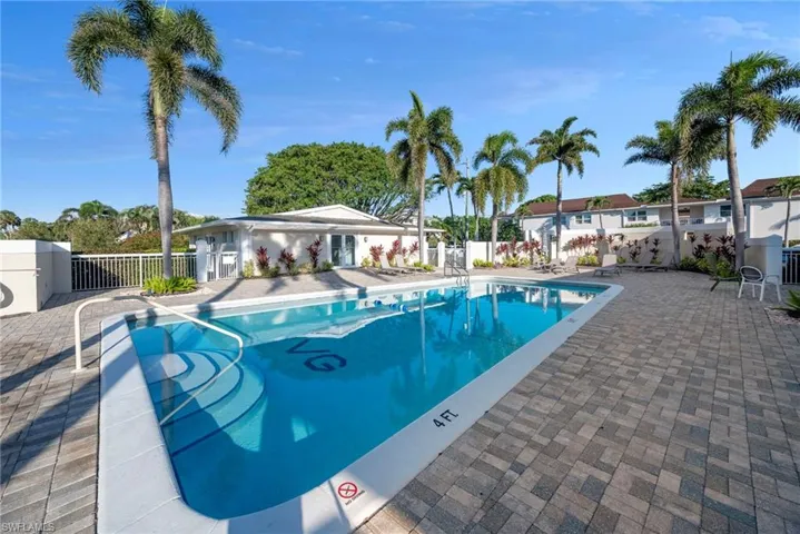 Community pool with a patio area