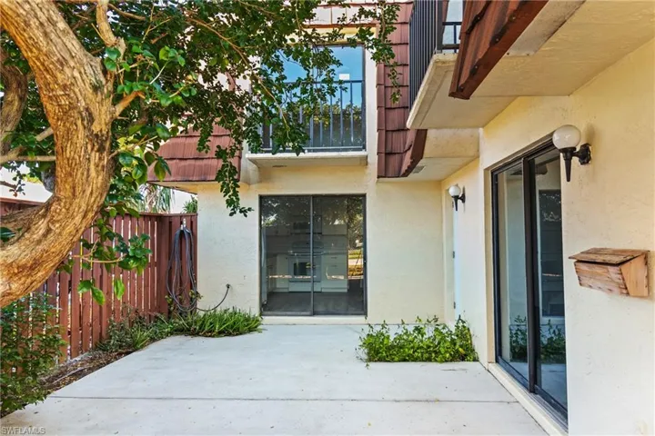 Property entrance with a patio