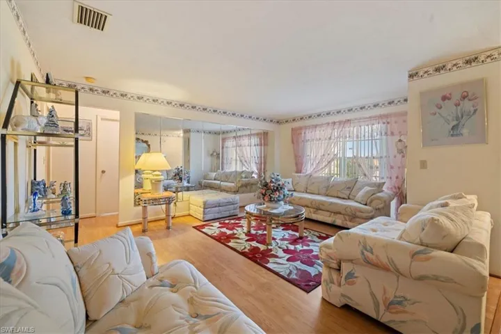 Living room with wood-type flooring