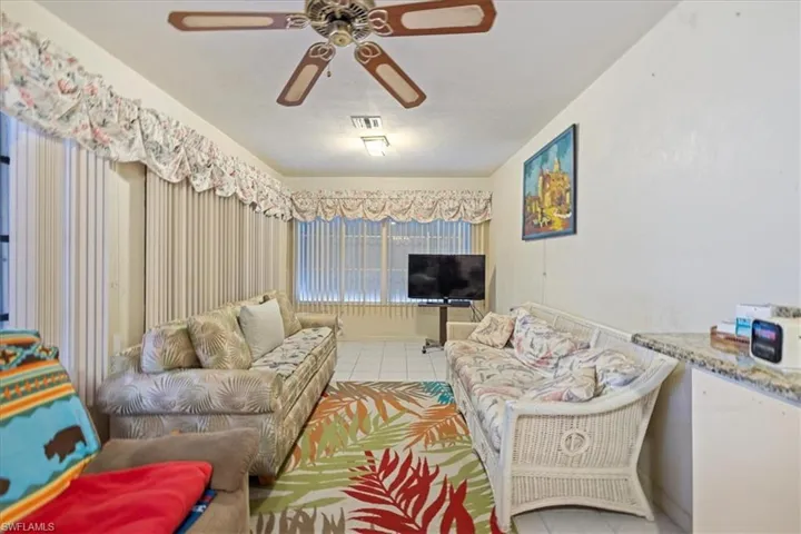 Tiled living room with ceiling fan