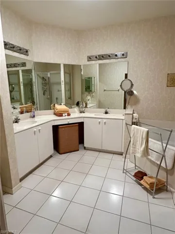 Bathroom with vanity and tile patterned floors