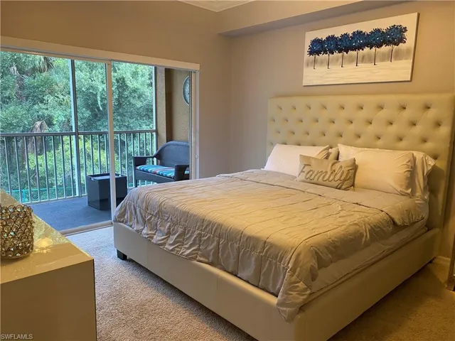 Master Bedroom with access to exterior and carpet floors