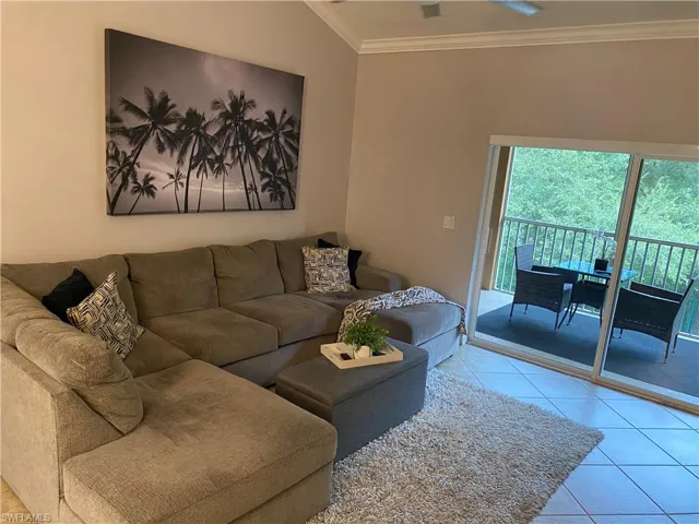 Tiled living room with crown molding