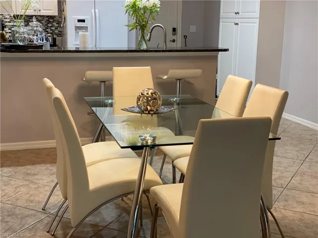 Tiled dining area with sink