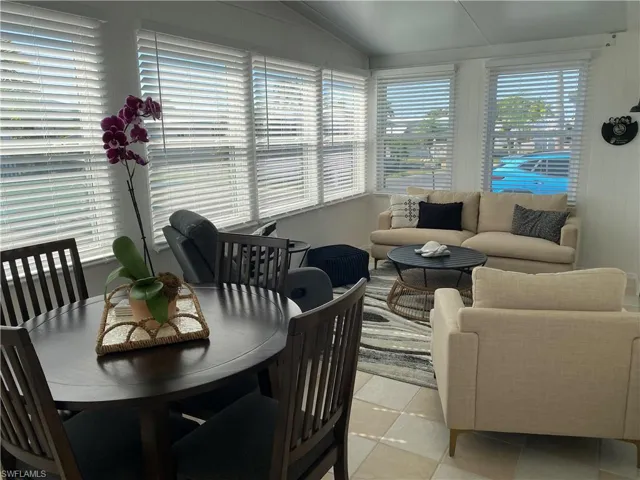 Sunroom / solarium with lofted ceiling