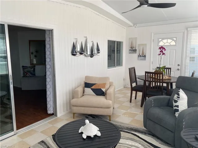 Living room featuring ceiling fan
