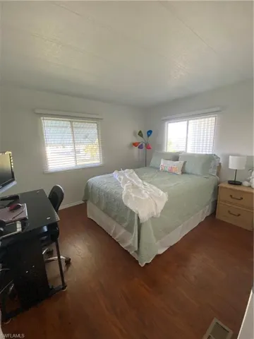 Bedroom featuring dark hardwood / wood-style flooring