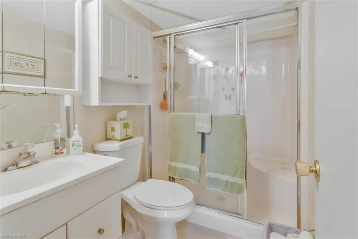 PRIMARY EN SUITE BATH WITH A STEP IN SHOWER