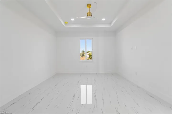 Spare room with ceiling fan and recessed lighting
