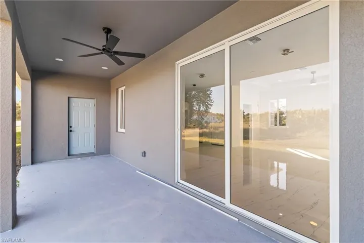 View of patio featuring a ceiling fan