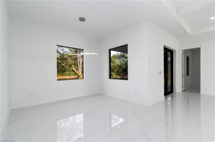 Dining room with baseboards and a healthy amount of sunlight