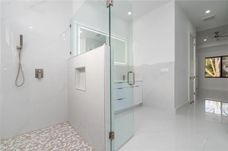 Full bathroom with visible vents, a marble finish shower, recessed lighting, tile patterned floors, and a ceiling fan