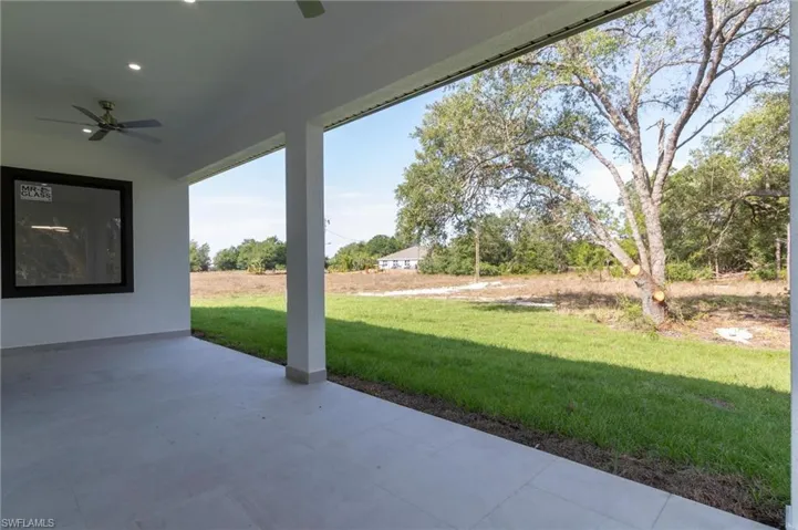 View of patio featuring ceiling fan
