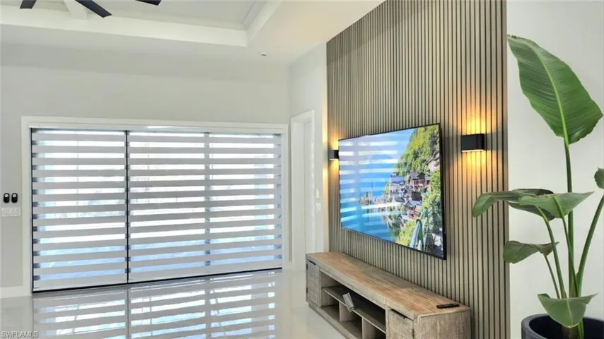 Living area featuring a raised ceiling