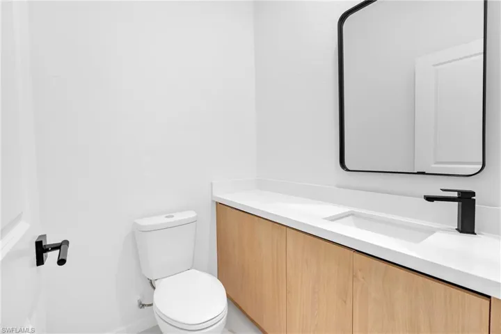 Half bath with vanity and toilet