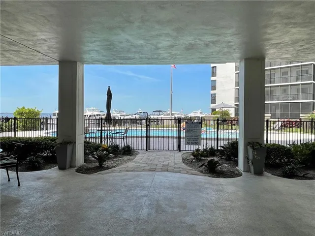 View of patio with a community pool