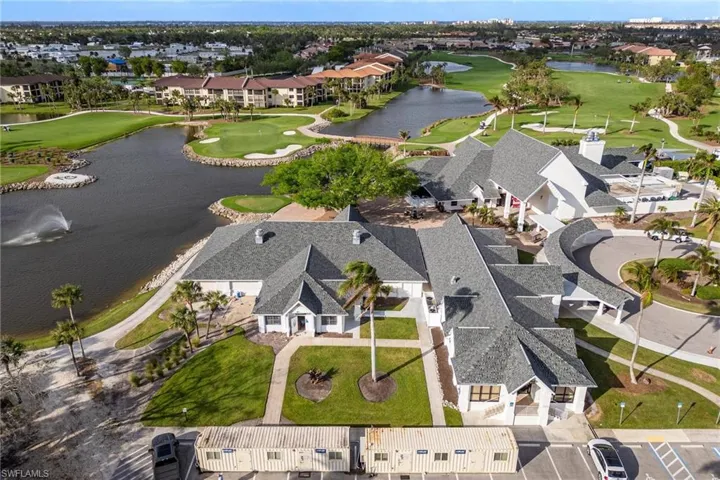 Aerial view with view of golf course, a residential view, and a water view