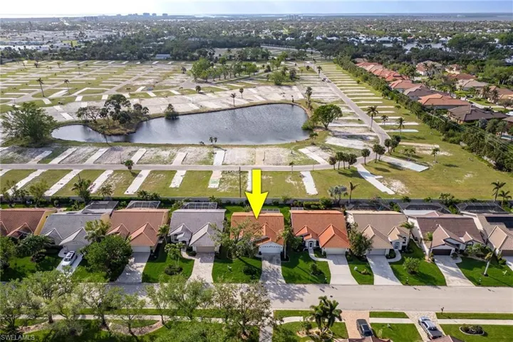 Drone / aerial view with a residential view and a water view