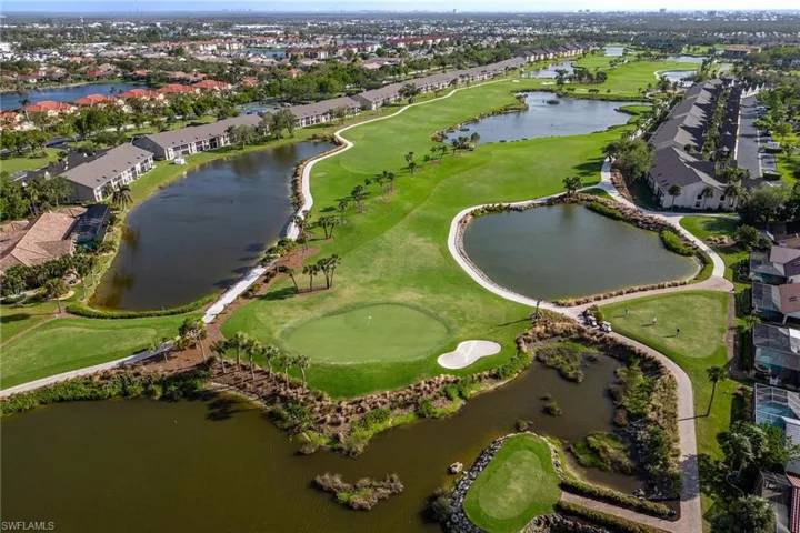Birds eye view of property with a water view, view of golf course, and a residential view