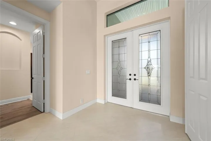 Foyer entrance featuring french doors