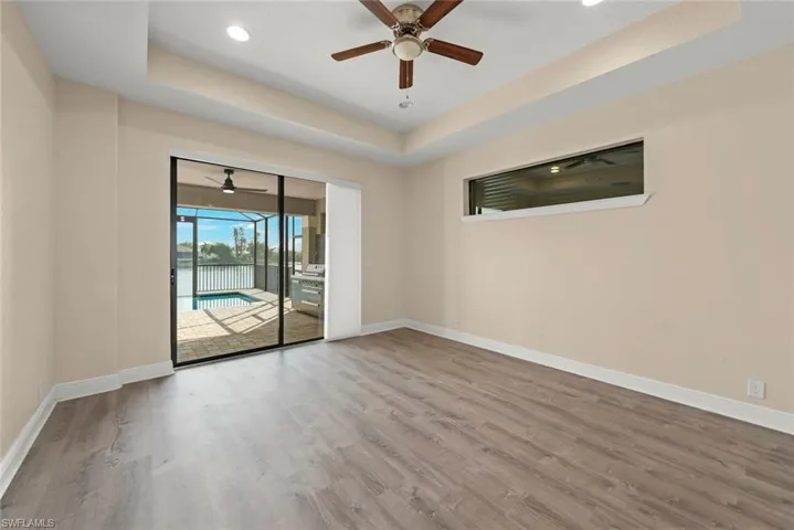 Master Bedroom overlooking pool and lake view