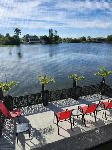 View of patio with a water view