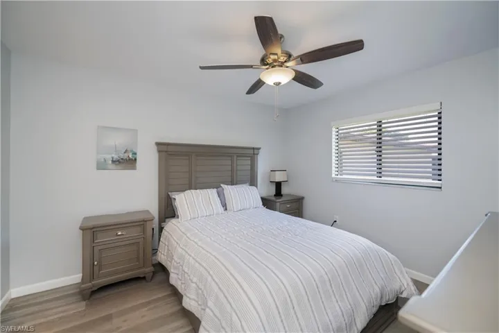 Bedroom with wood finished floors and ceiling fan