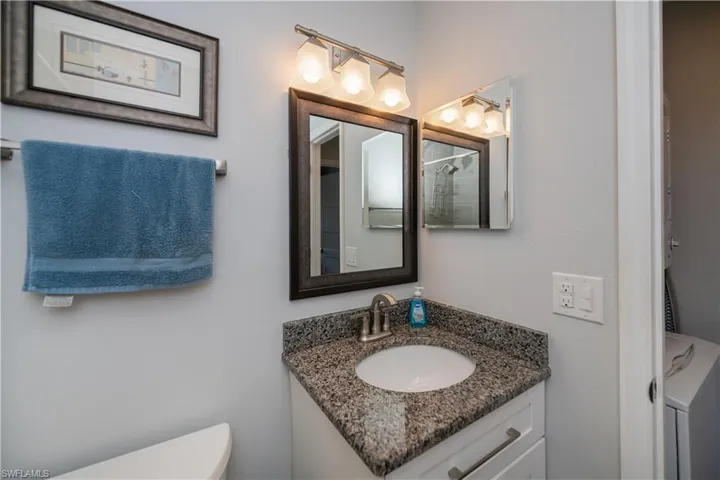 Full bath with vanity and an enclosed shower