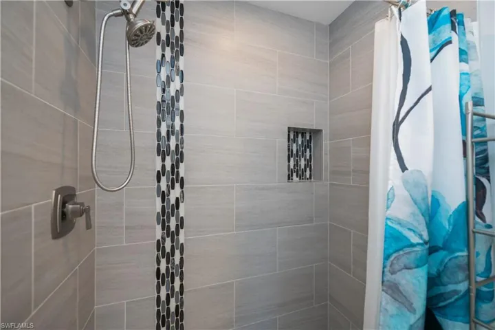 Bathroom featuring tiled shower