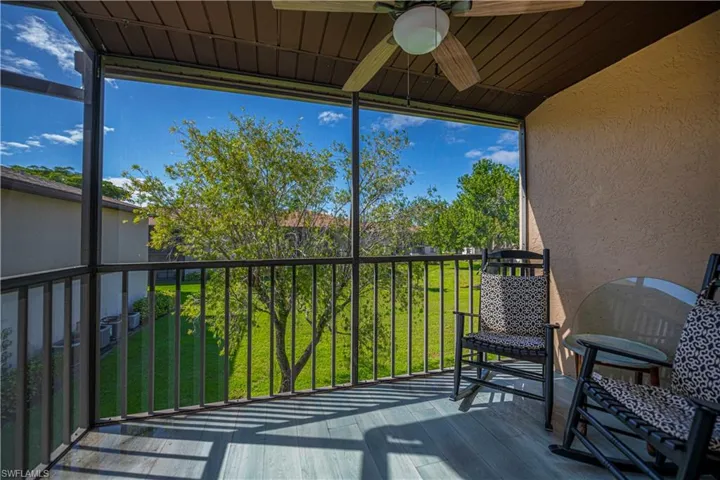 Balcony featuring ceiling fan